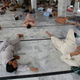 People rest in a mosque on a hot afternoon in Karachi, Pakistan.